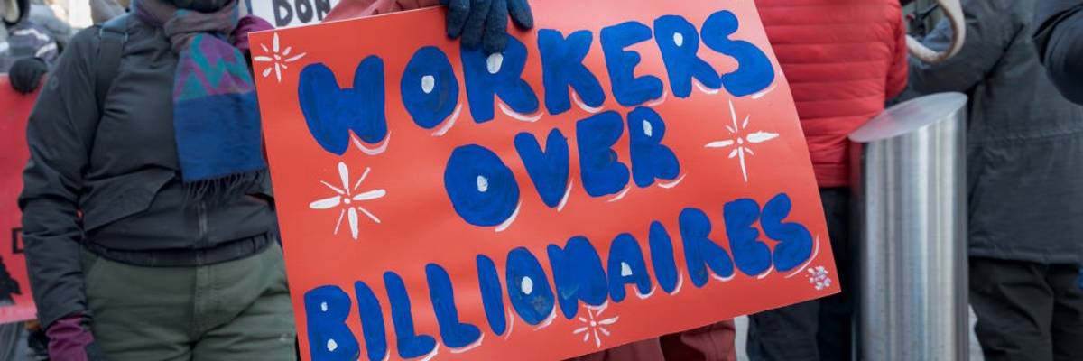 Federal workers and allies protest mass layoffs.