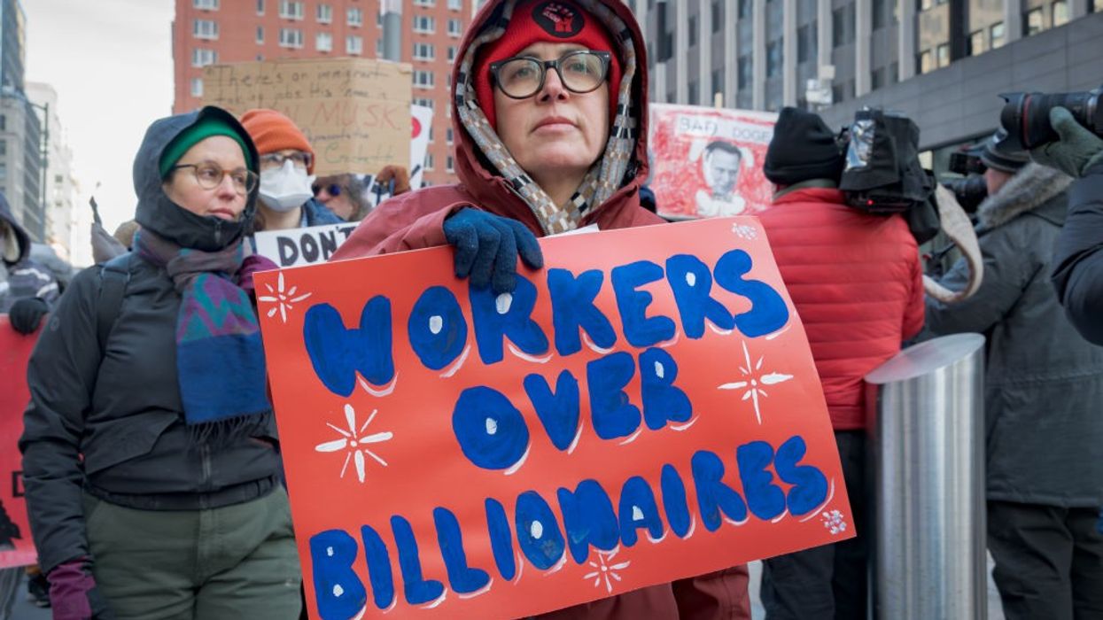 Federal workers and allies protest mass layoffs.