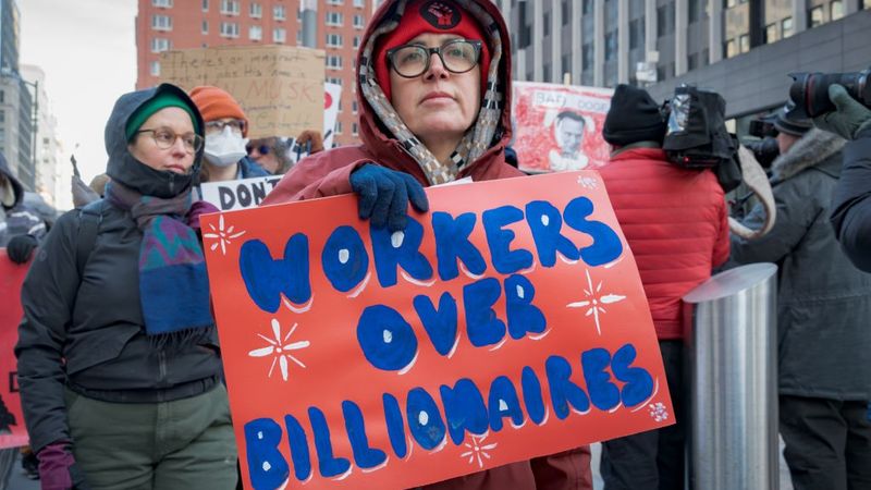 Federal workers and allies protest mass layoffs.