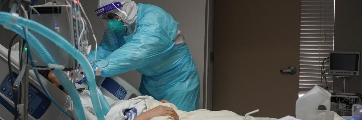 Fernando Olvera adjusts a ventilator on a patient in the Covid-19 intensive care unit at the United Memorial Medical Center on December 2, 2020 in Houston. (Photo: Go Nakamura via Getty Images)