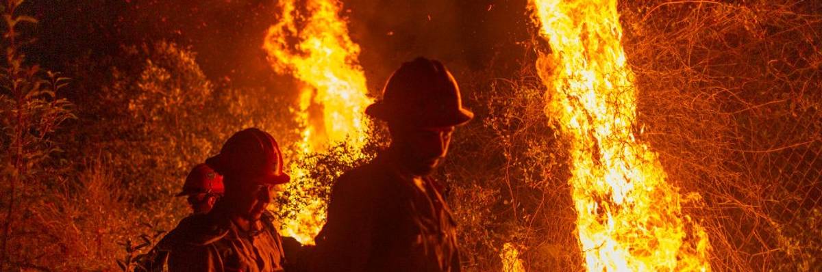 Fightfighters walking away from backfire they set