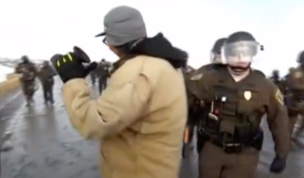 Filmmaker Jahnny Lee shortly before his arrest while recording an DAPL protest. (image: Reed Lindsay)
