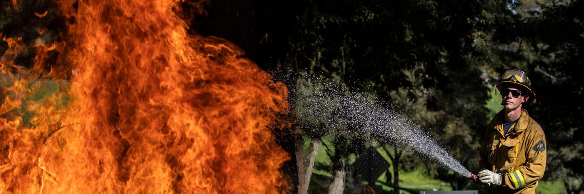 firefigher cools flames