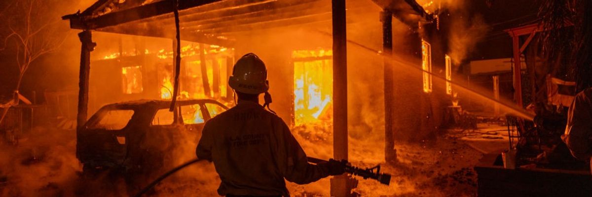 Firefighter fighting blaze in Los Angeles