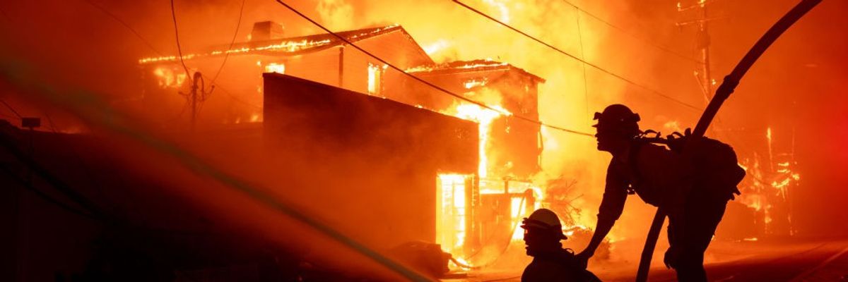 Firefighters battle an inferno consuming homes in Malibu, California.