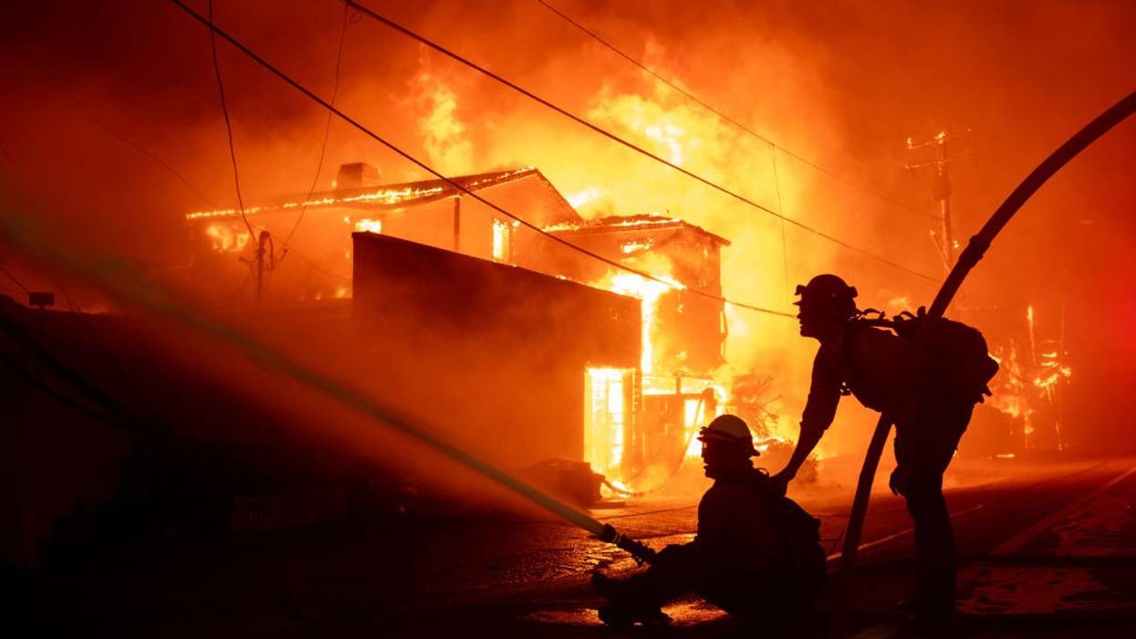 Firefighters battle an inferno consuming homes in Malibu, California.