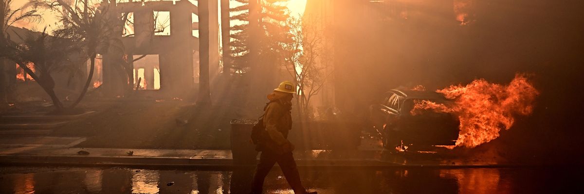 Firefighters battle the Coastal fire in Laguna Niguel, California on May 11, 2022.