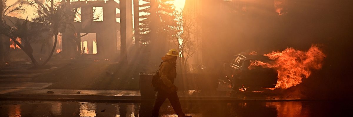 Firefighters battle the Coastal fire in Laguna Niguel, California on May 11, 2022. 