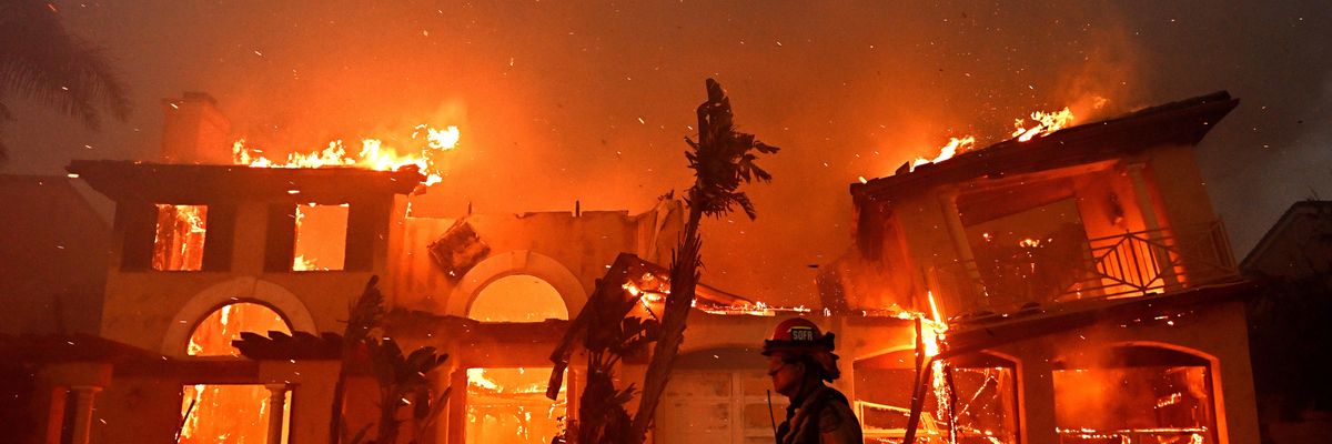 Firefighters battle the Coastal Fire in Laguna Niguel, California on May 11, 2022.