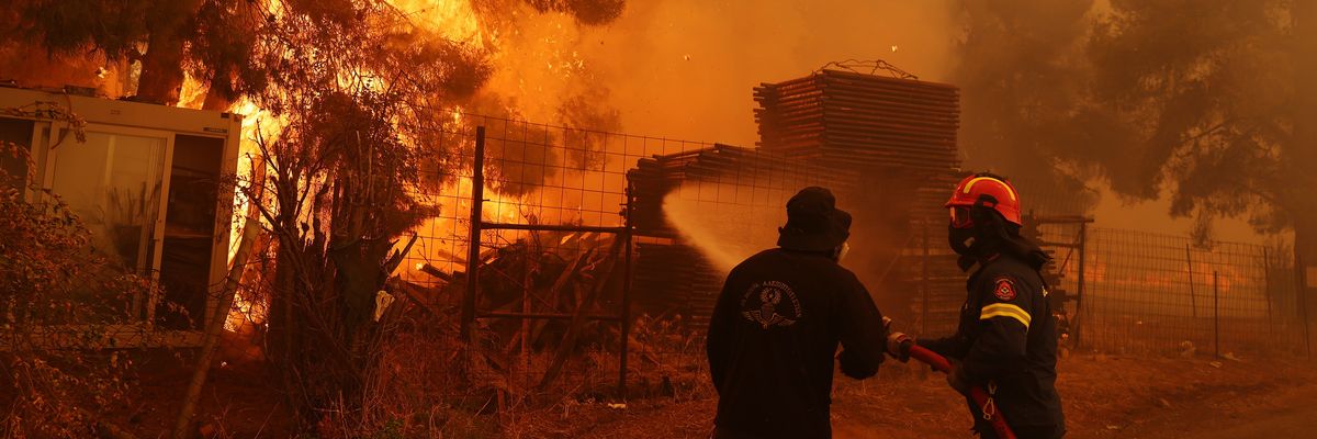 Firefighters fight a wildfire near Athens, Greece.
