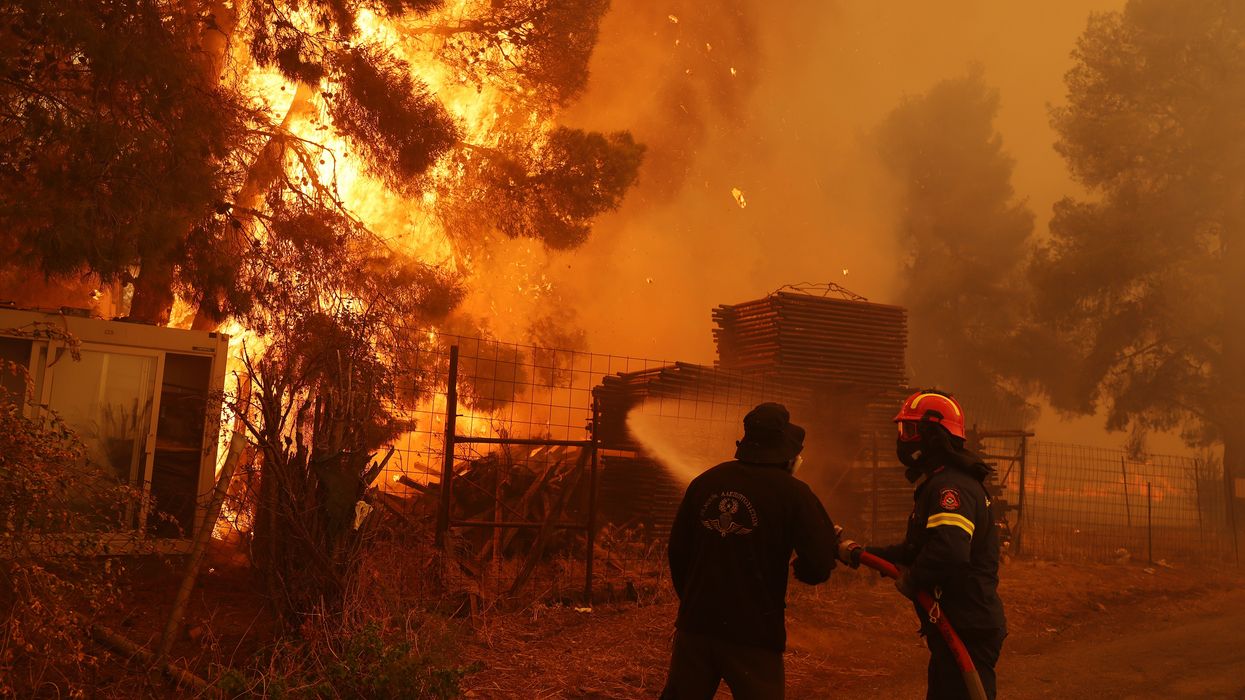 Firefighters fight a wildfire near Athens, Greece.