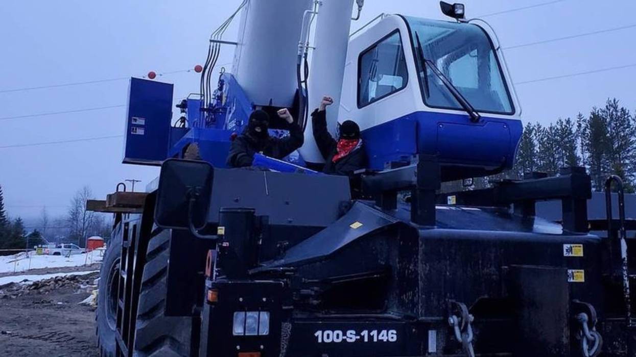 First Nations land defenders lock themselves to equipment at a Trans Mountain Corporation pumping station