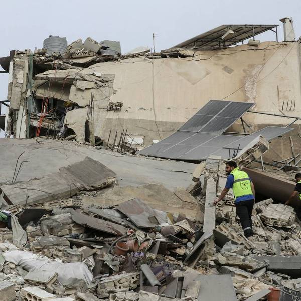 First responders inspect the site of an Israeli airstrike in the southern Lebanese village of Abbasiyeh