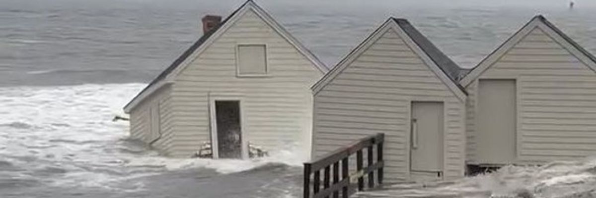 Fishing shacks washed into sea