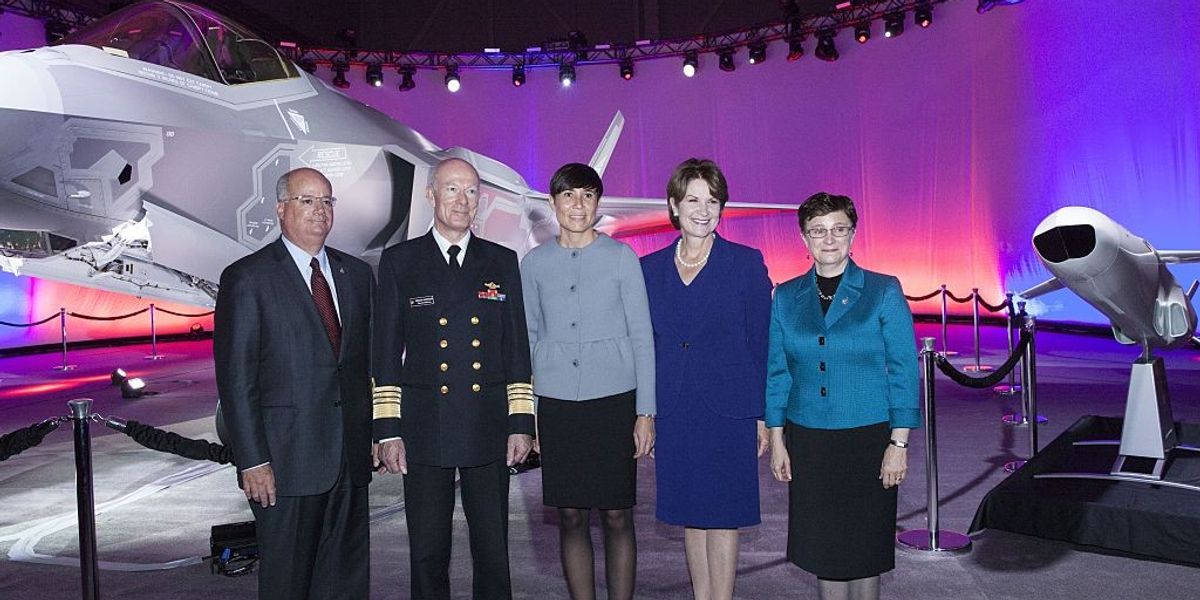 five-people-stand-in-front-of-an-f-35-ai