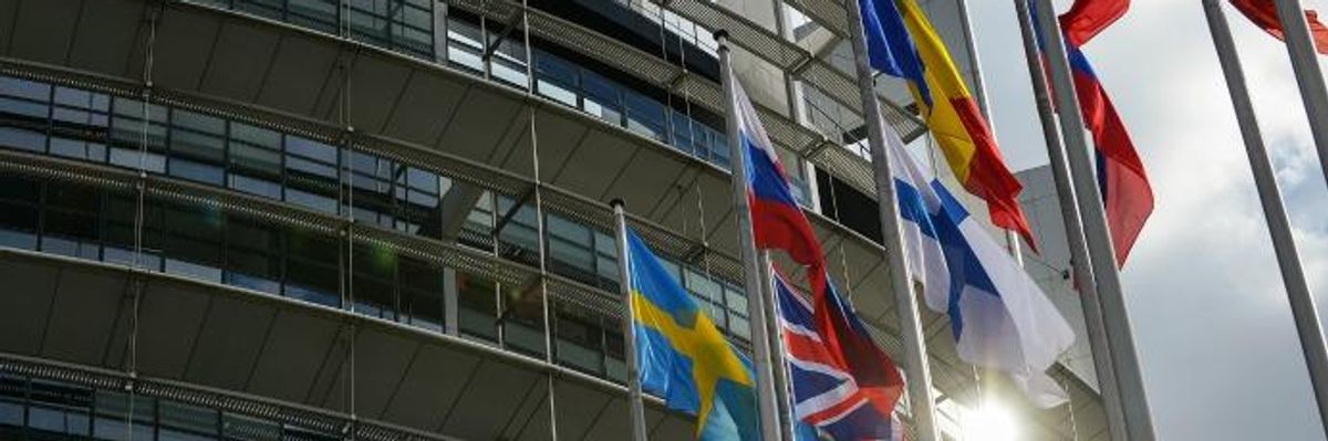 Flags outside the European Parliament building.