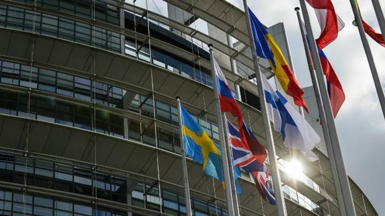 Flags outside the European Parliament building.