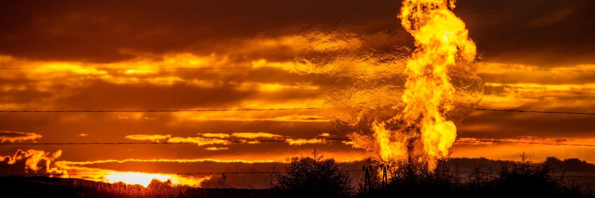 Flames rise from a flaring pit near a well in the Bakken Oil Field. The primary component of natural gas is methane, which is odorless when it comes directly out of the gas well. (Photo: Orjan F. Ellingvag/Corbis via Getty Images)