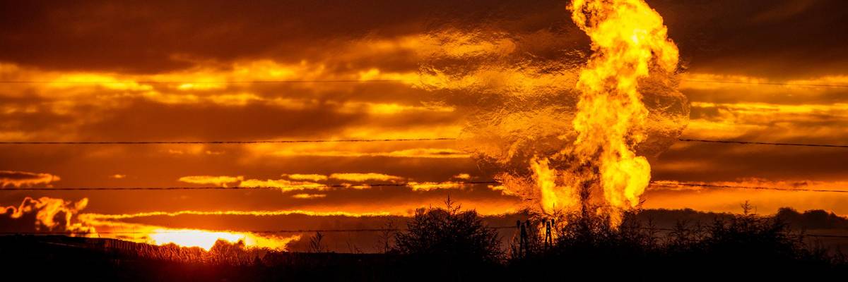 Flames rise from a flaring pit near a well in the Bakken Oil Field. The primary component of natural gas is methane, which is odorless when it comes directly out of the gas well. (Photo: Orjan F. Ellingvag/Corbis via Getty Images)