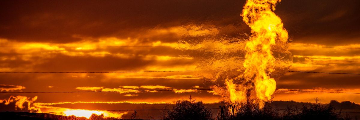 Flames rise from a flaring pit near a well in the Bakken Oil Field. The primary component of natural gas is methane, which is odorless when it comes directly out of the gas well. (Photo: Orjan F. Ellingvag/Corbis via Getty Images)