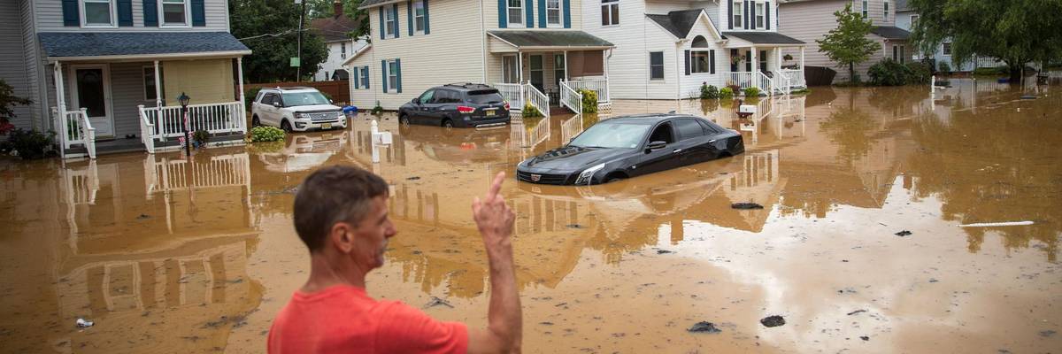 Flooded street and cars after extreme storm
