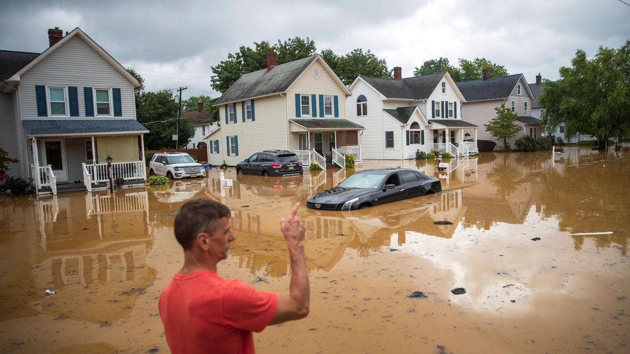 Flooded street and cars after extreme storm