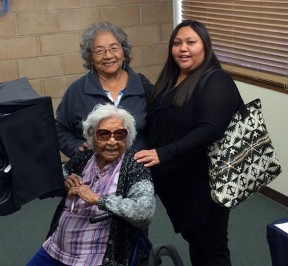 Flora Green with four generations of her family at the newly opened early voting location.