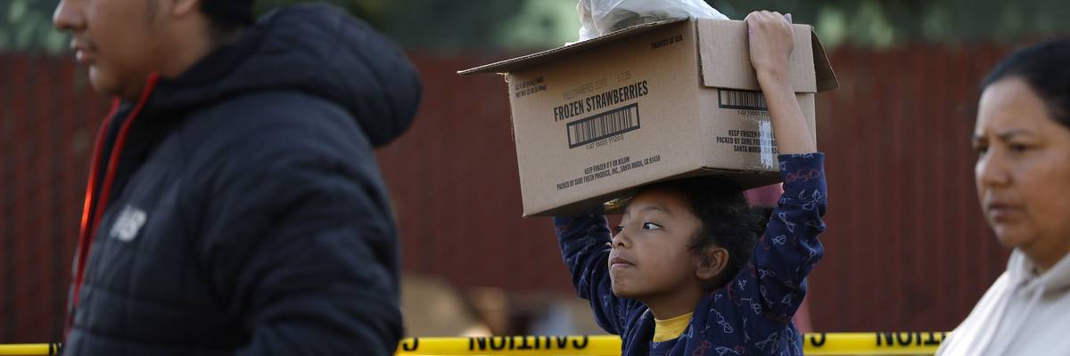 Food Bank Hands Out Meals Ahead Of Thanksgiving Holiday