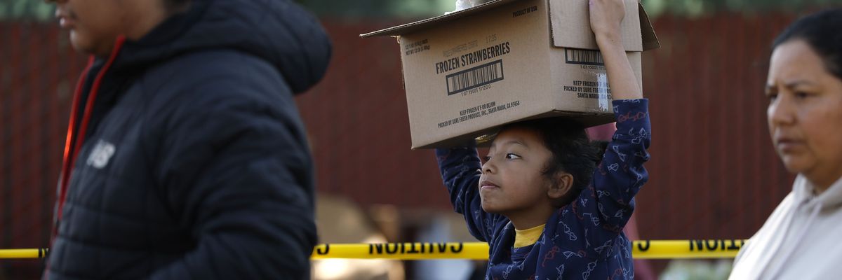 Food Bank Hands Out Meals Ahead Of Thanksgiving Holiday
