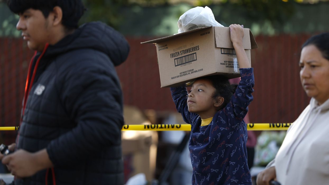 Food Bank Hands Out Meals Ahead Of Thanksgiving Holiday