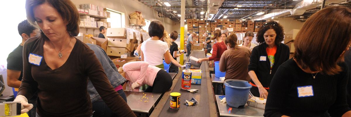 Food bank volunteers sorting food.