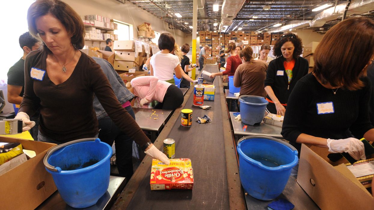 Food bank volunteers sorting food.