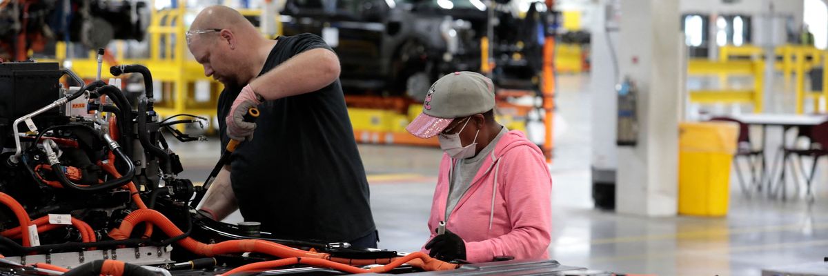Ford workers build an electric F-150 Lightning at a factory in Dearborn, Michigan on September 8, 2022.