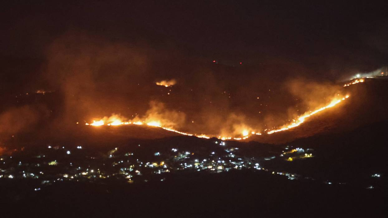 Forest fires sweep through the outskirts of the southern village of Kfar Shouba as a result of Israeli shelling that targeted the area
