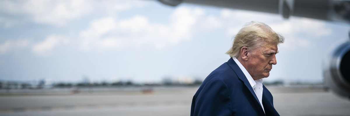 Former President Donald Trump boards his private jet on March 13, 2023 in West Palm Beach, Florida.