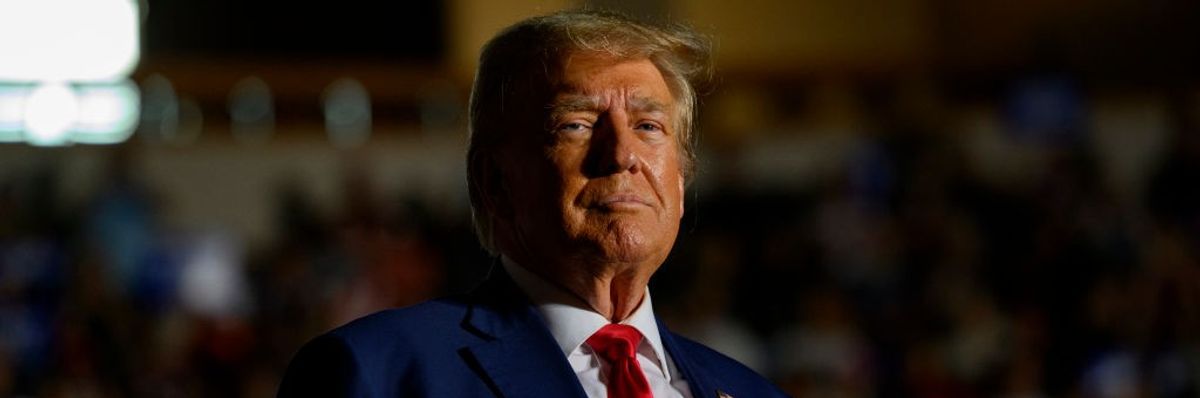 Former President Donald Trump looks at the camera.