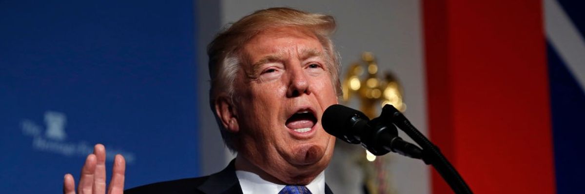 Former President Donald Trump speaks at a podium.