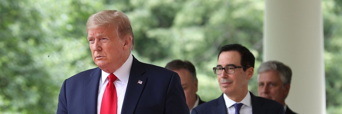 Former President Donald Trump walks at the White House