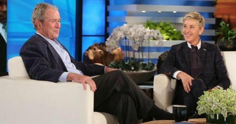 Former president George W. Bush, who lied the nation into war against Iraq, appearing on the show Ellen, hosted by comedian Ellen Degeneres. (Image: Screengrab)