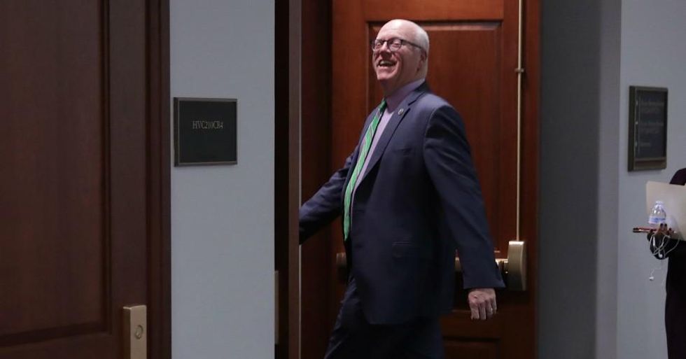 Former Rep. Joe Crowley (D-NY) joked with journalists as he headed into a Democratic caucus meeting in the U.S. Capitol Visitors Center on November 14, 2018 in Washington, DC. After losing his seat to Congress following a successful primary challenge by Ocasio-Cortez, Crowley did what many other ex-lawmakers also do: joined a powerful lobby group. (Photo by Chip Somodevilla/Getty Images)