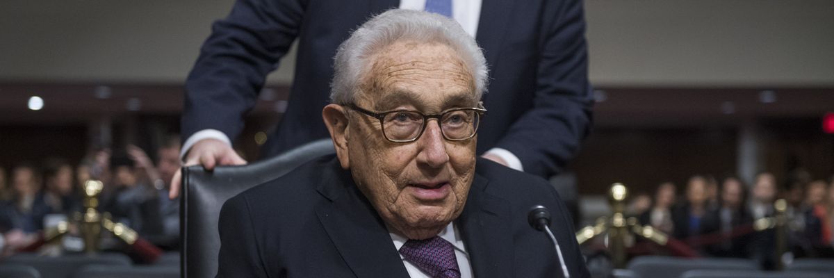 Former Secretary of State Henry Kissinger arrives to testify at a Senate hearing.