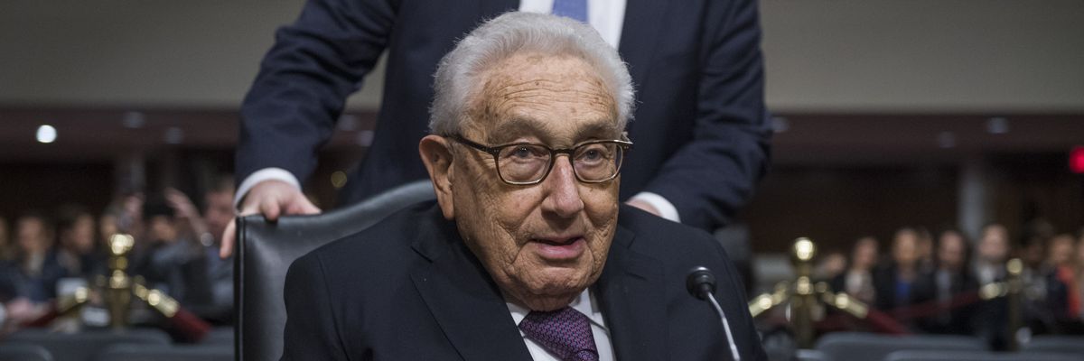 Former Secretary of State Henry Kissinger arrives to testify at a Senate hearing