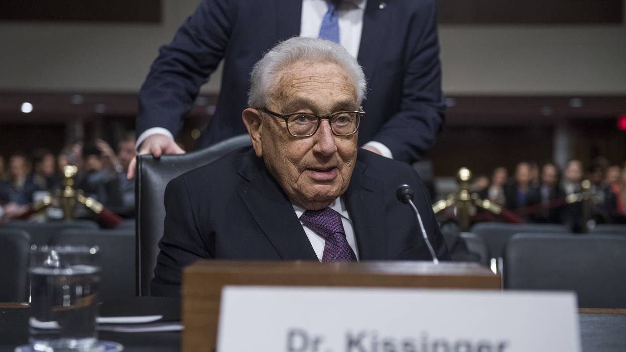 Former Secretary of State Henry Kissinger arrives to testify at a Senate hearing