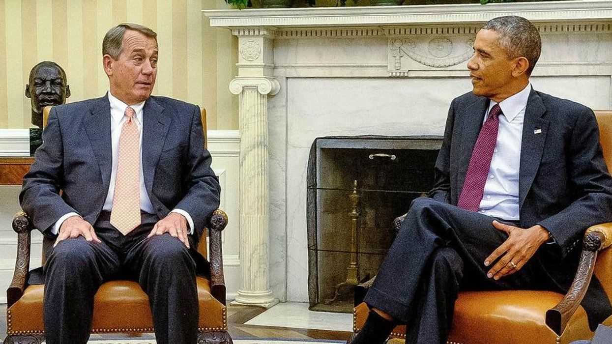 Former U.S. President Barack Obama, right, talks with then-House Speaker John Boehner in the White House.