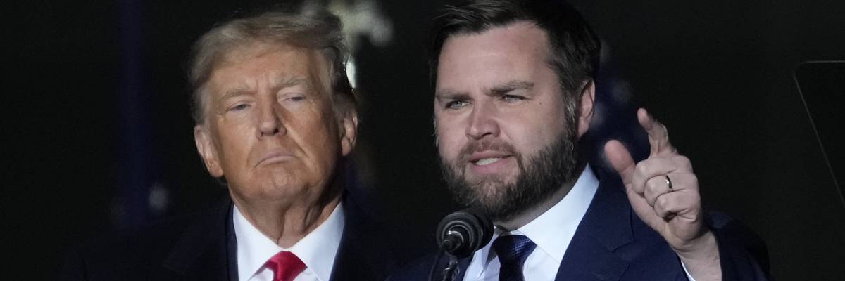 Former U.S. President Donald Trump and Republican U.S. Senate candidate J.D. Vance greet supporters during a rally on November 7, 2022 in Vandalia, Ohio.