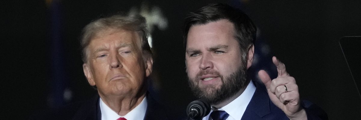 Former U.S. President Donald Trump and Republican U.S. Senate candidate J.D. Vance greet supporters during a rally on November 7, 2022 in Vandalia, Ohio.