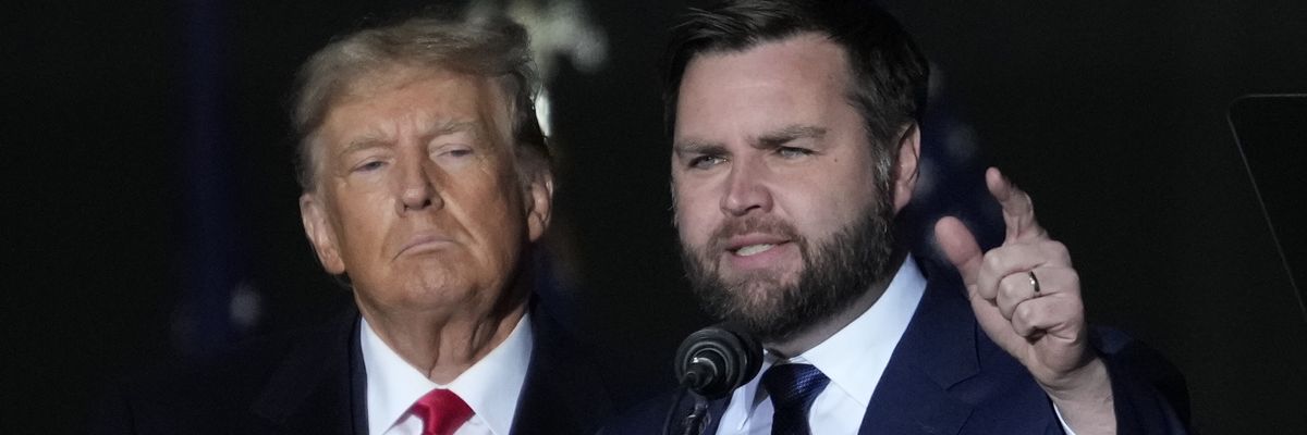 Former U.S. President Donald Trump and Republican U.S. Senate candidate J.D. Vance greet supporters during a rally on November 7, 2022 in Vandalia, Ohio.