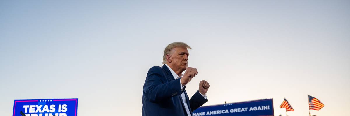 Former U.S. President Donald Trump dances after hosting a campaign rally at Texas' Waco Regional Airport on March 25, 2023.