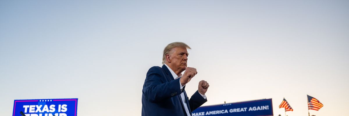 Former U.S. President Donald Trump dances after hosting a campaign rally at Texas' Waco Regional Airport on March 25, 2023.