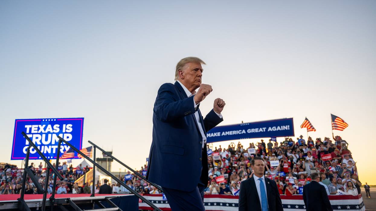 Former U.S. President Donald Trump dances after hosting a campaign rally at Texas' Waco Regional Airport on March 25, 2023.